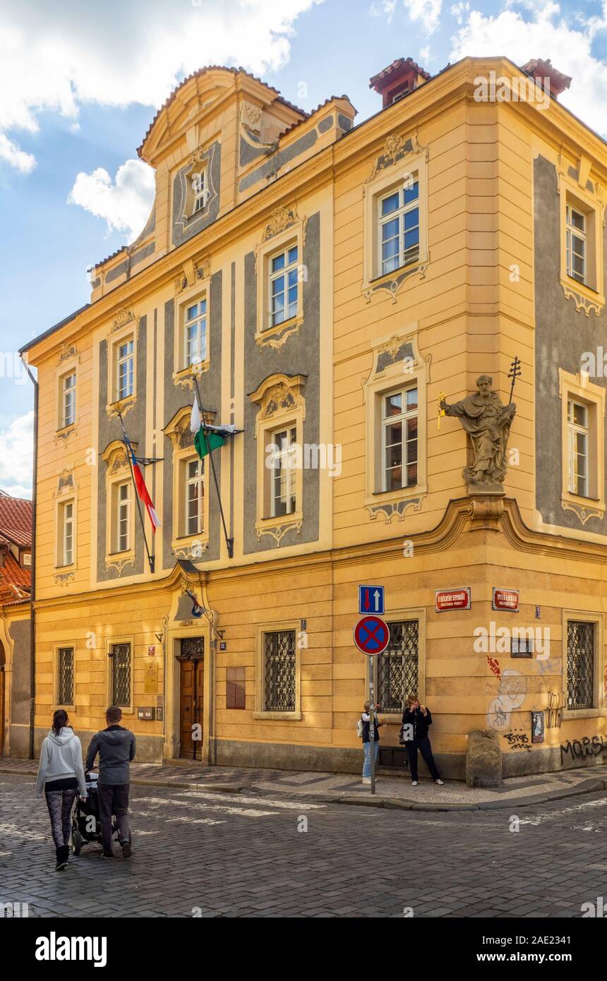 People walking past the Liaison Office of the Free State of Saxony in Lesser Town Prague Czech Republic. Stock Photo
