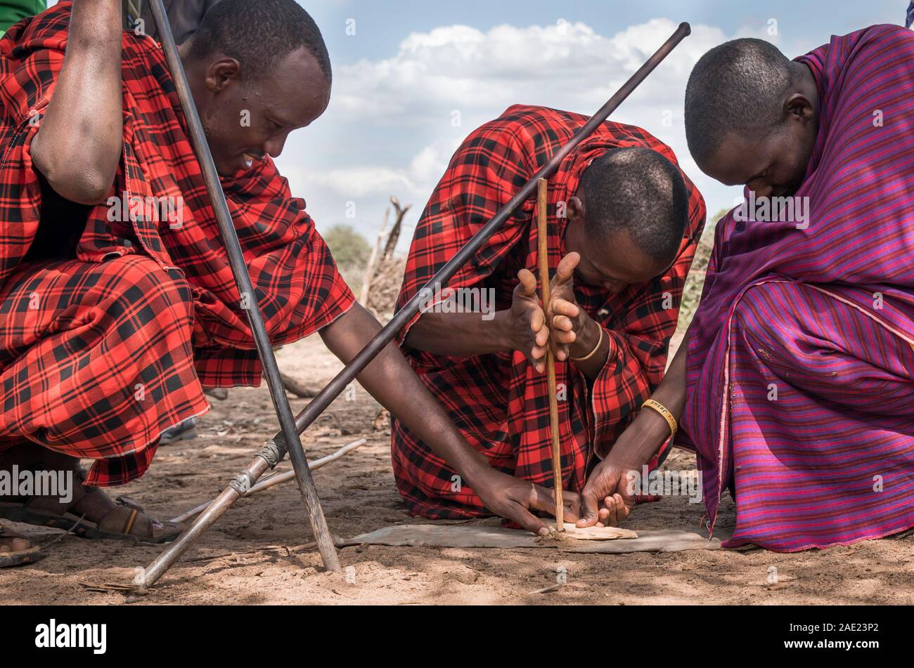 Same, Tanzania, 6th June, 2019:  Maasai men making fire Stock Photo