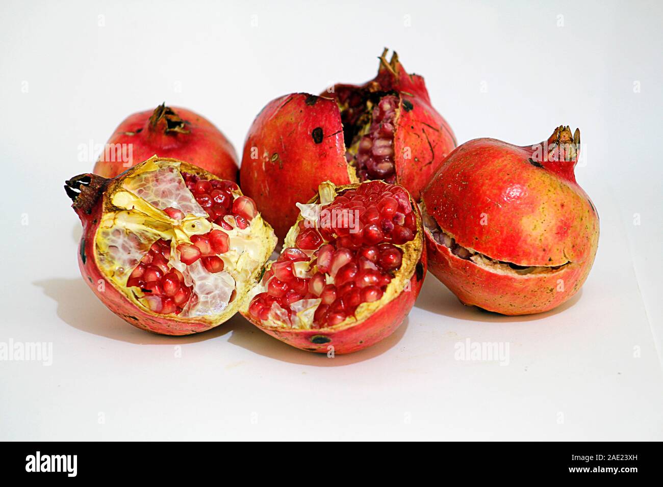 Ripe pomegranate isolated on white background Stock Photo