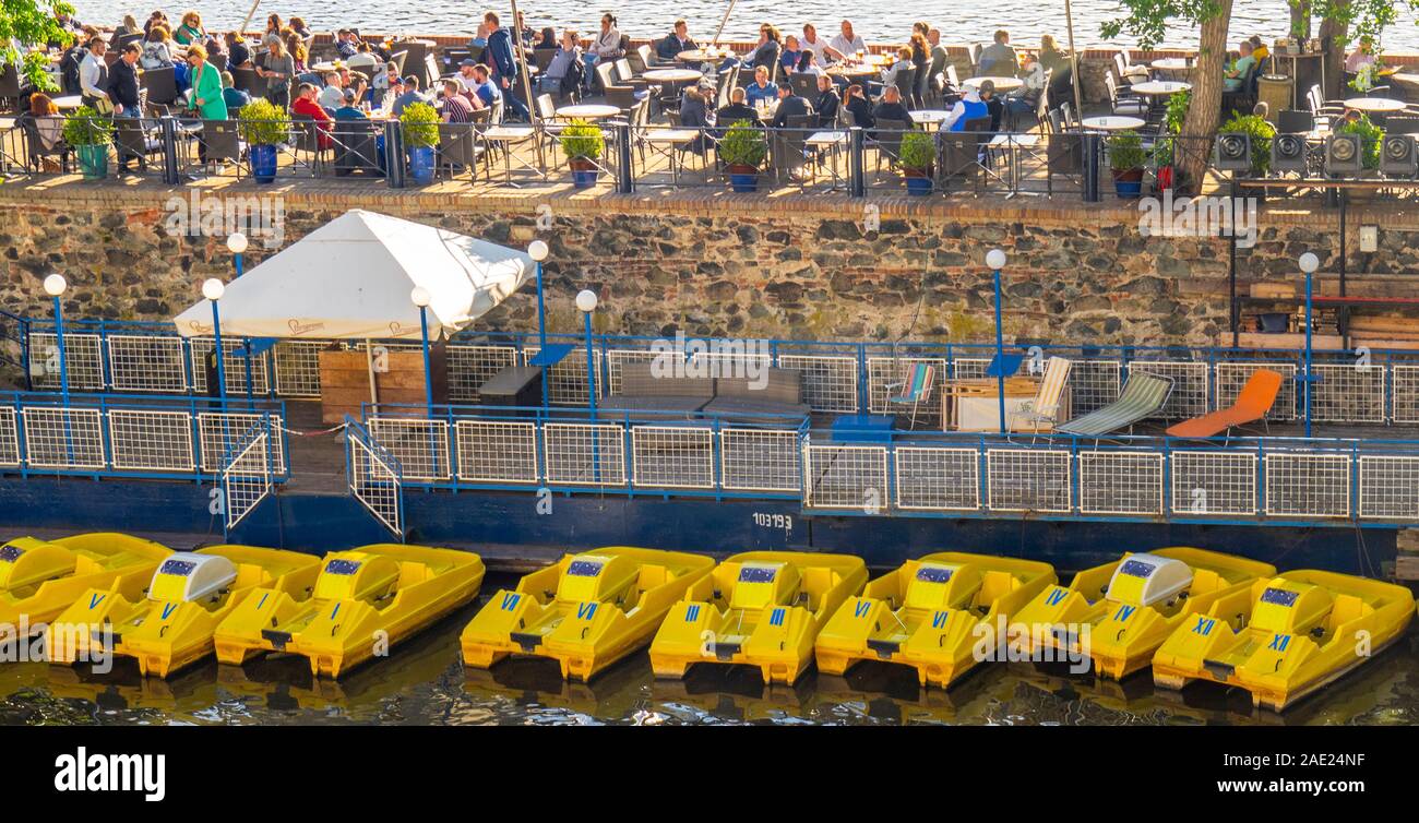 Klub Lávka yellow plastic pedal boats for hire to paddle the Vltava