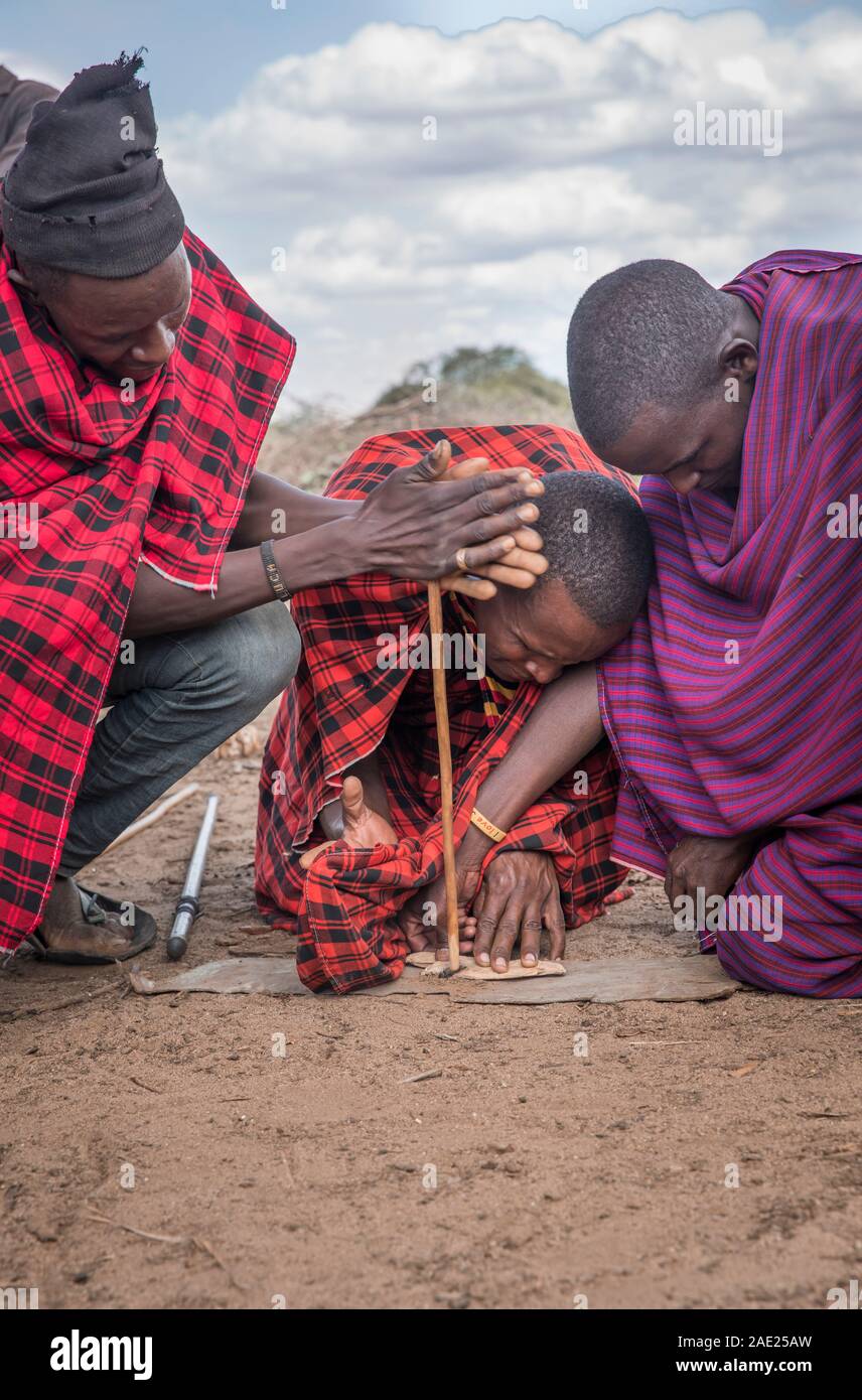 Same, Tanzania, 6th June, 2019:  Maasai men making fire Stock Photo