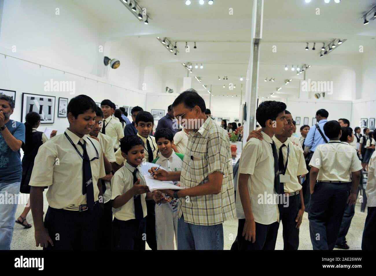 Signing autographs, Jagdish Agarwal photography exhibition, Jehangir Art Gallery, Bombay, Mumbai, Maharashtra, India, Asia Stock Photo