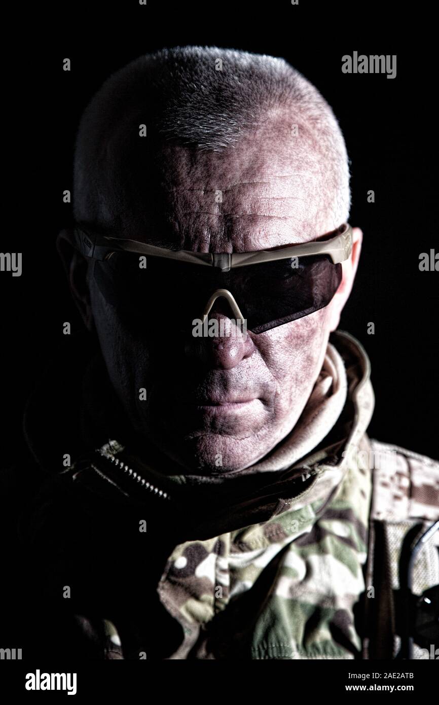Elderly commando fighter studio portrait on black Stock Photo - Alamy
