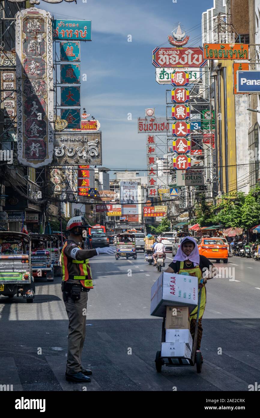 Traffic policeman and woman working in China Town Bangkok Thailand Stock Photo