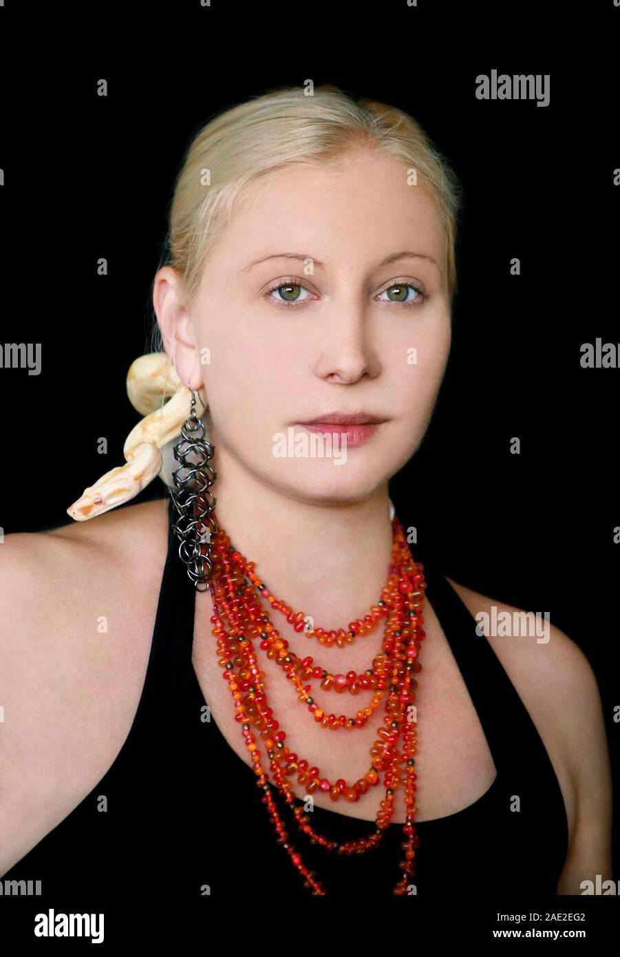 Portrait of girl with Boa constrictor albino snake on head. Woman with ...