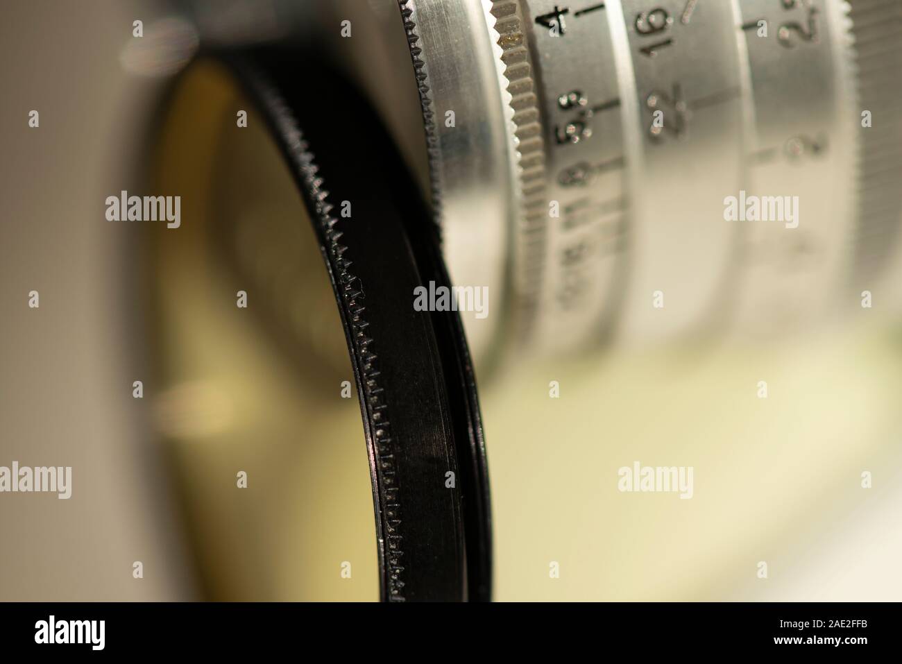 Extreme close up of vintage filter thread or filter ring and silver manual Russian camera lens. Stock Photo