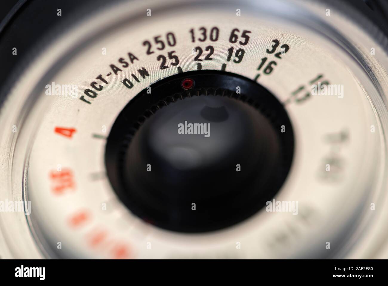 Film camera lens front controls as ASA and DIN values marking close up detail on old vintage Russian camera Stock Photo