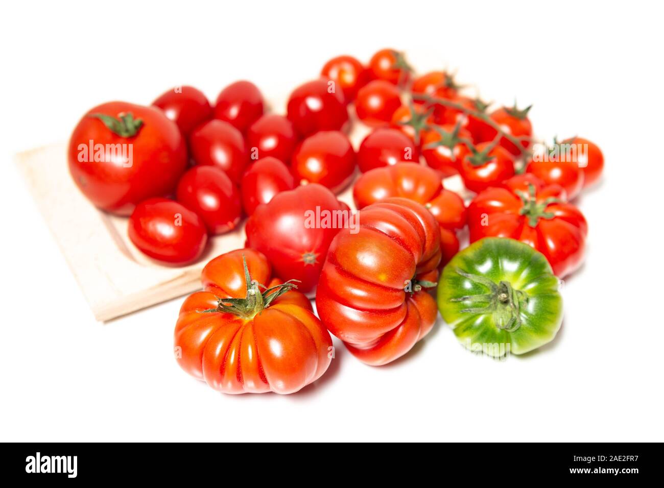 A composition of various types of tomatoes, such as the Florentine Costoluto, the cherry and the datterino. Typical in the Mediterranean diet tomatoes Stock Photo