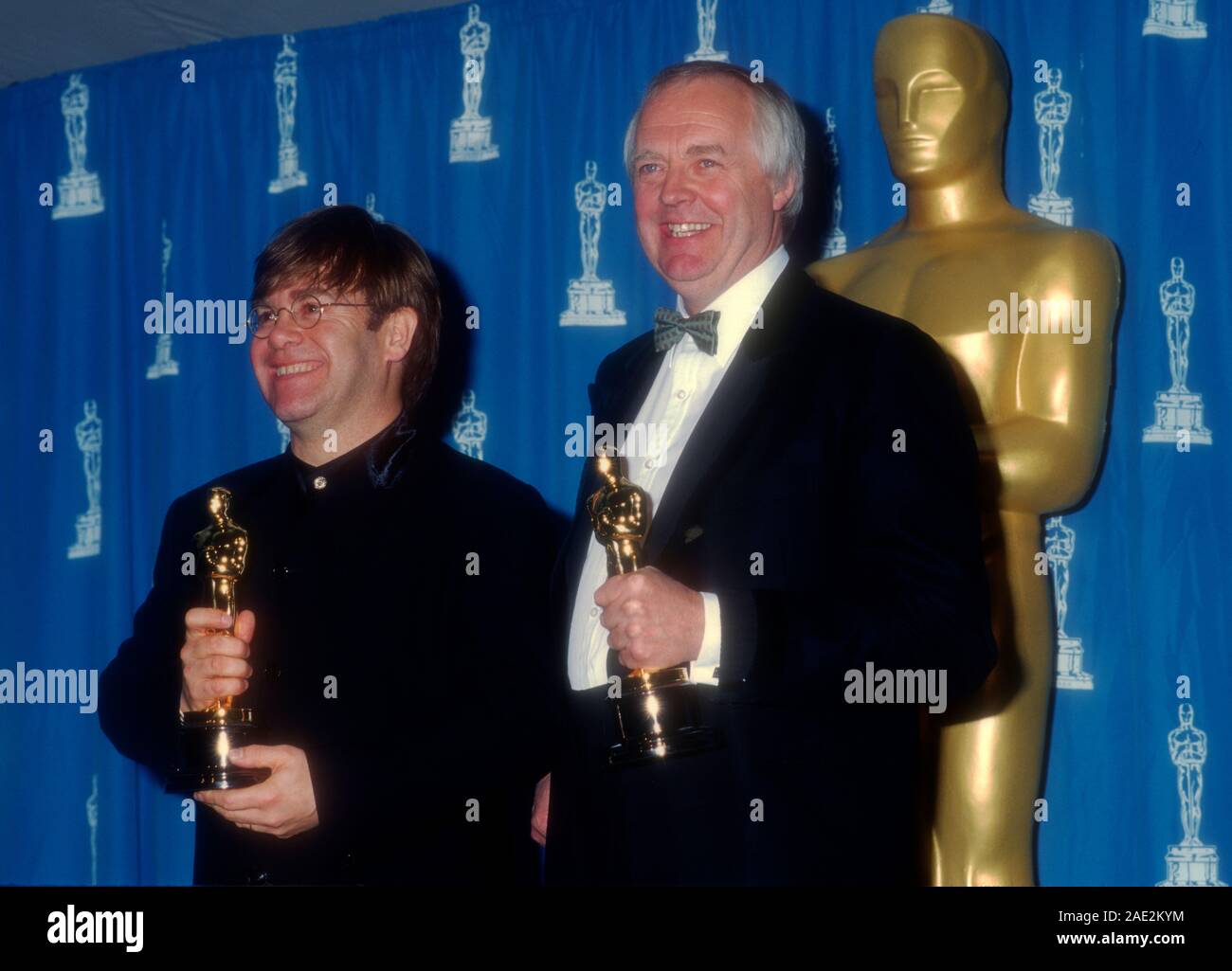 Los Angeles, California, USA 27th March 1995 Singer/musician Elton John and lyricist Tim Rice attend the 67th Annual Academy Awards on March 27, 1995 at Shrine Auditorium in Los Angeles, California,