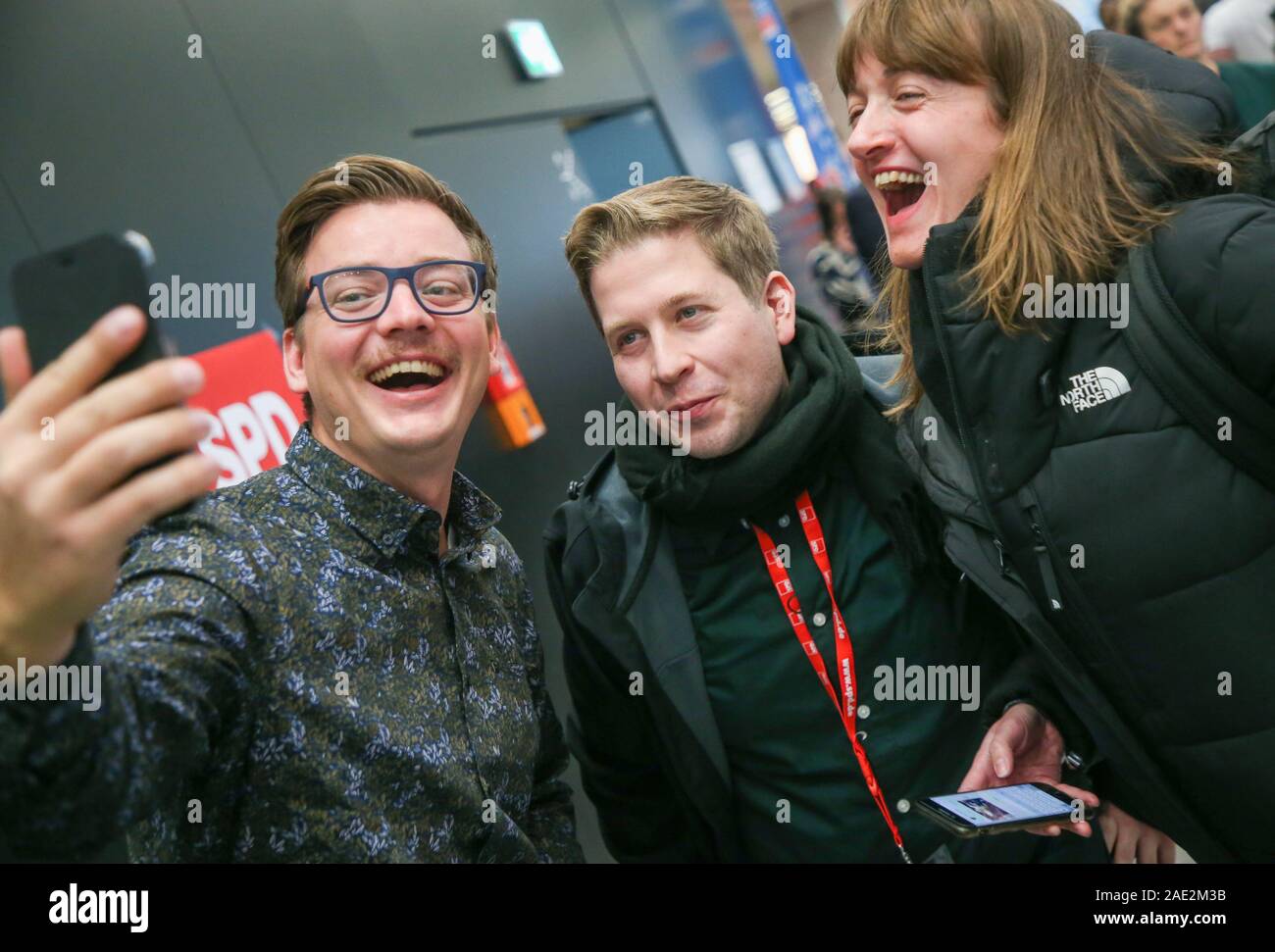 Berlin, Germany. 06th Dec, 2019. Kevin Kühnert (M), federal chairman of the Jusos, has himself photographed with Tobias Pietsch (SPD, l) and Julie Rothe, federal managing director of the Jusos, at the SPD federal party conference. From 06 December 2019 to 08 December 2019, the SPD wants to elect a new leadership team at the party conference. Credit: Wolfgang Kumm/dpa/Alamy Live News Stock Photo