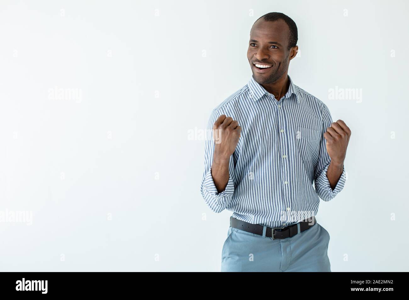 Positive afro american man feeling lucky Stock Photo