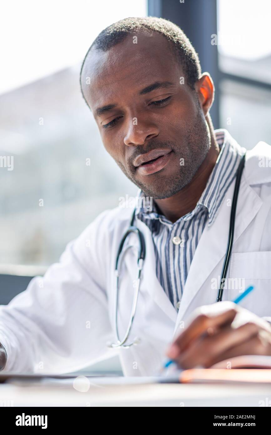 Portrait of delighted man that making notes Stock Photo - Alamy