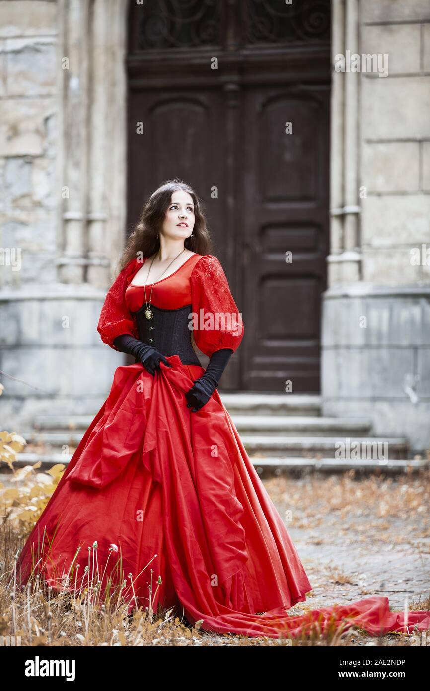 Woman in a red Victorian dress Stock Photo