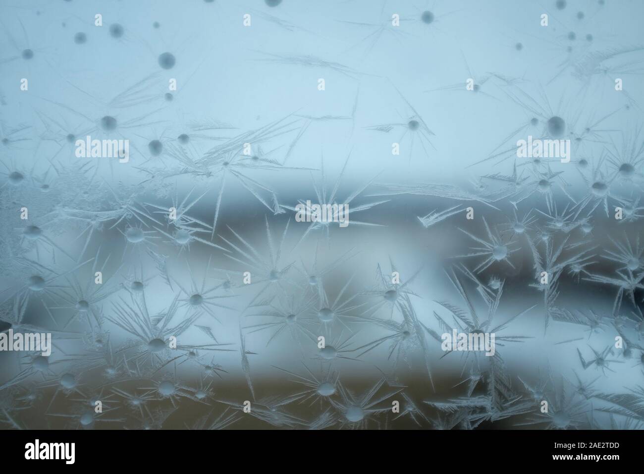 Delicate patterns of ice crystals on a frosted window conceptual of ...