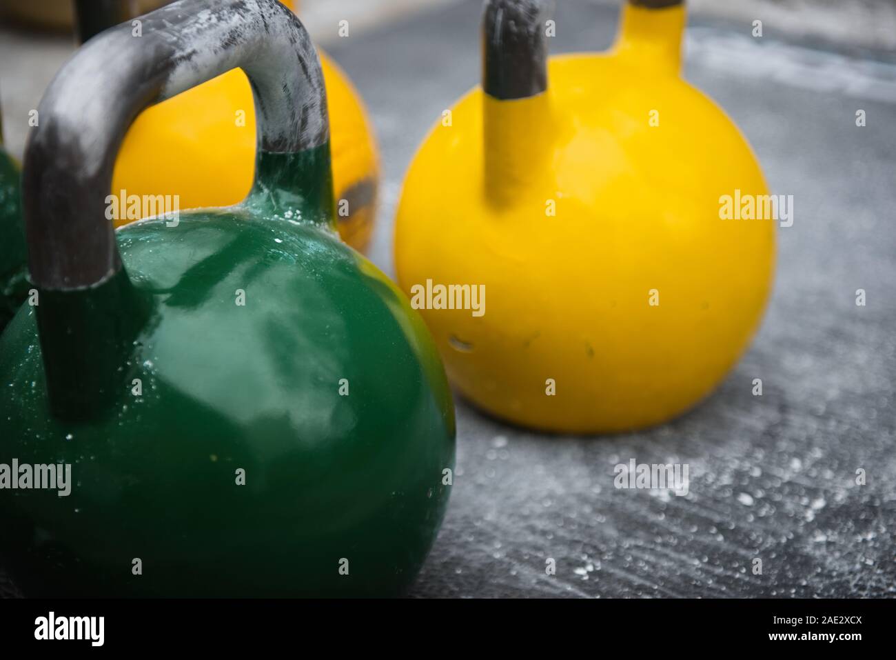 Old used kettlebell outside on the floor ready for strength and