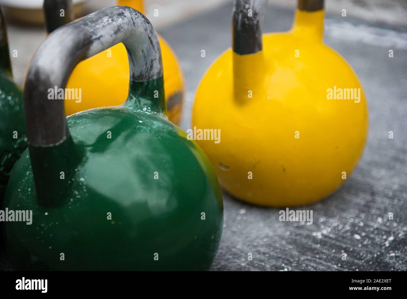Old used kettlebell outside on the floor ready for strength and