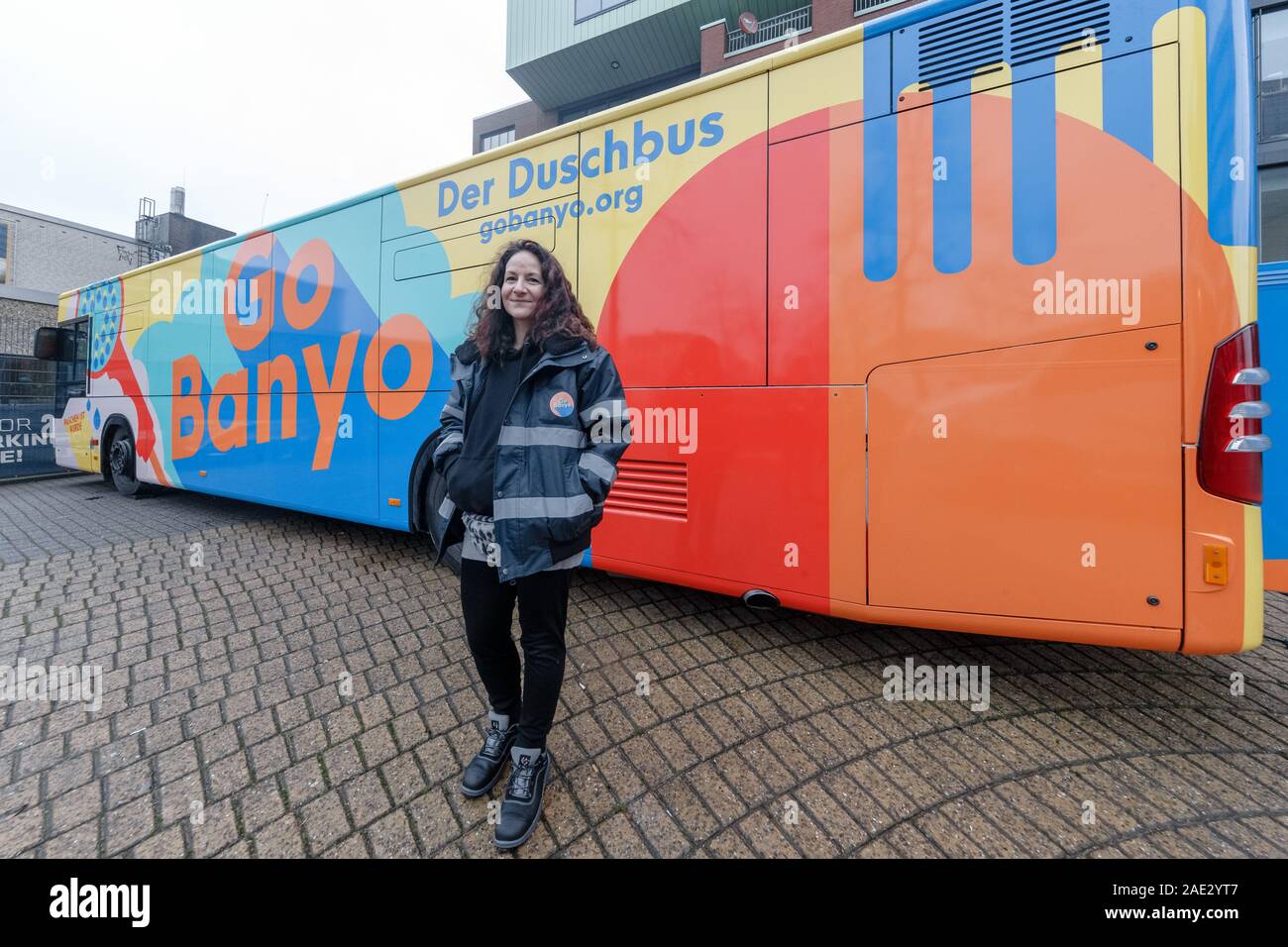 Hamburg, Germany. 06th Dec, 2019. Stella Markotic, volunteer coordinator of GoBany gGmbh, stands in front of the shower bus. The vehicle, a crowdfunded project, offers three washrooms and showers for the homeless. Credit: Markus Scholz/dpa/Alamy Live News Stock Photo