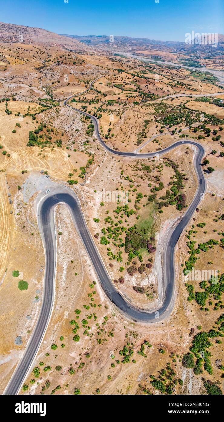 Aerial view of Kahta Sincik Road near the village of Taslica, District of Kahta, Adiyaman Province, Turkey. Winding roads surrounded by nature Stock Photo