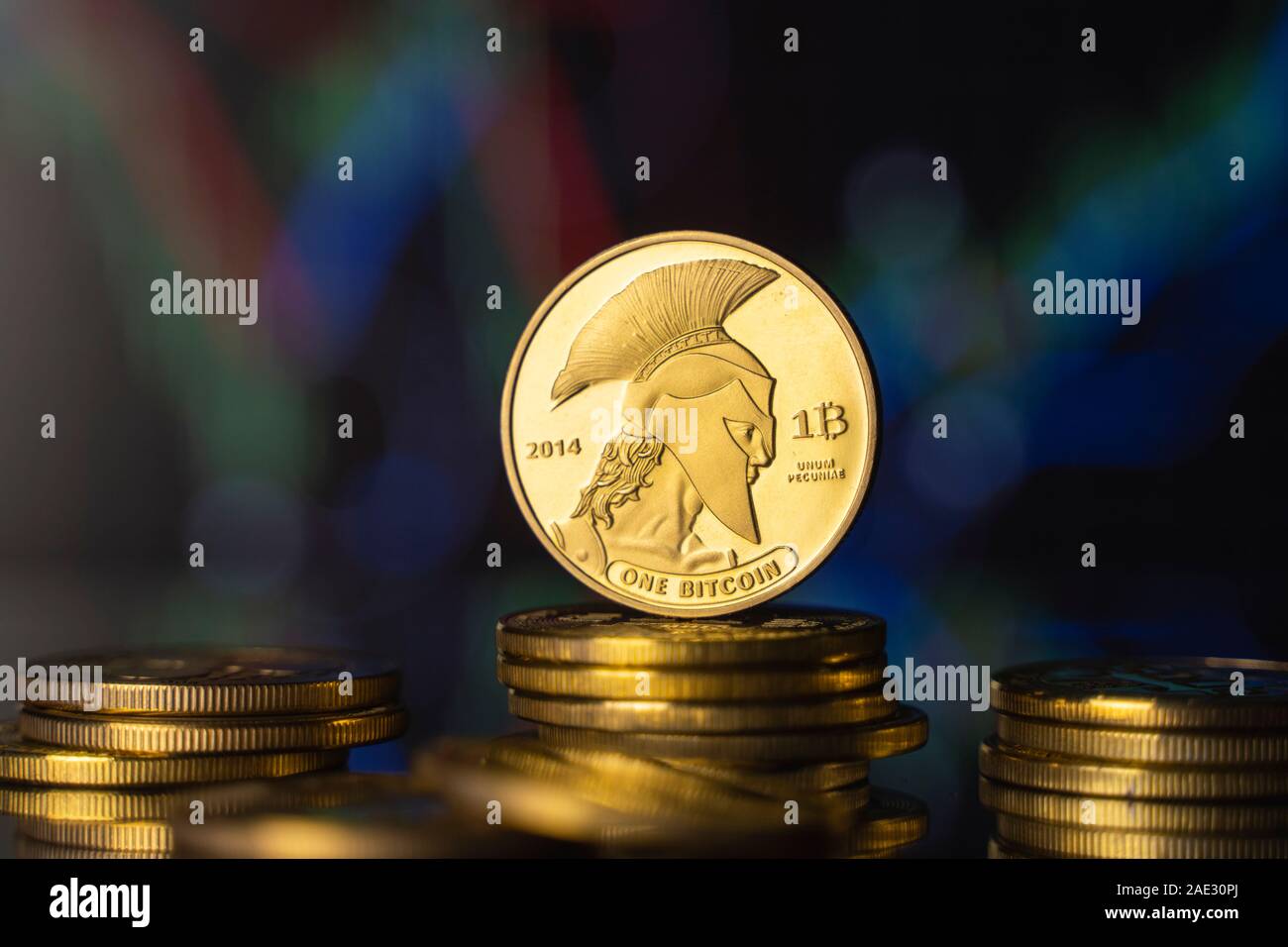 Titan bitcoin and virtual money concept. Gold Titan on a stack of coins  with chart of growing and falling valuance of a cryptocurrency. Mining or  Stock Photo - Alamy