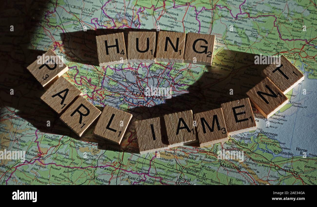 Hung parliament spelt spelling Scrabble letters on a UK map - General Election, elections, party political,leaders,parties,claims,doubts Stock Photo