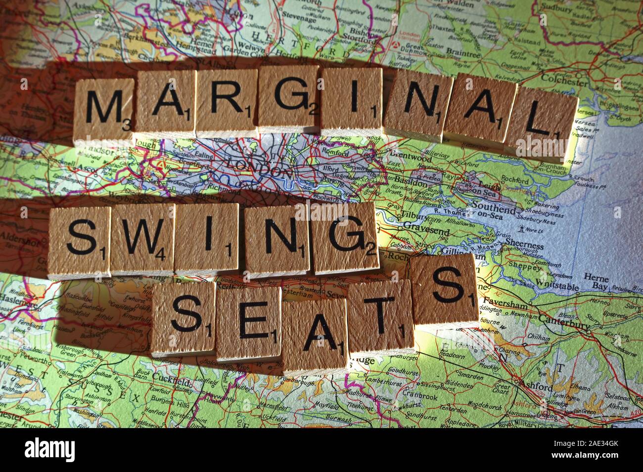 Marginal Swing Seats spelt in Scrabble letters on a UK map - General Election, elections, party political,leaders,parties,claims,doubts Stock Photo