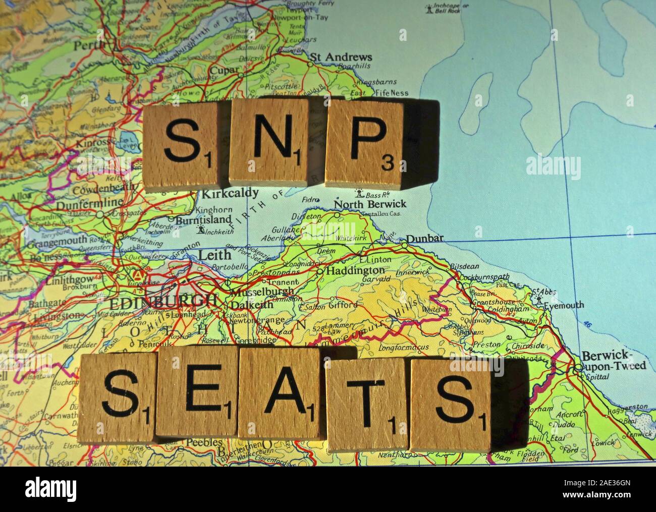 SNP seats spelled in Scrabble letters on a UK map - General Election, elections, party political,leaders,parties,claims,doubts Stock Photo