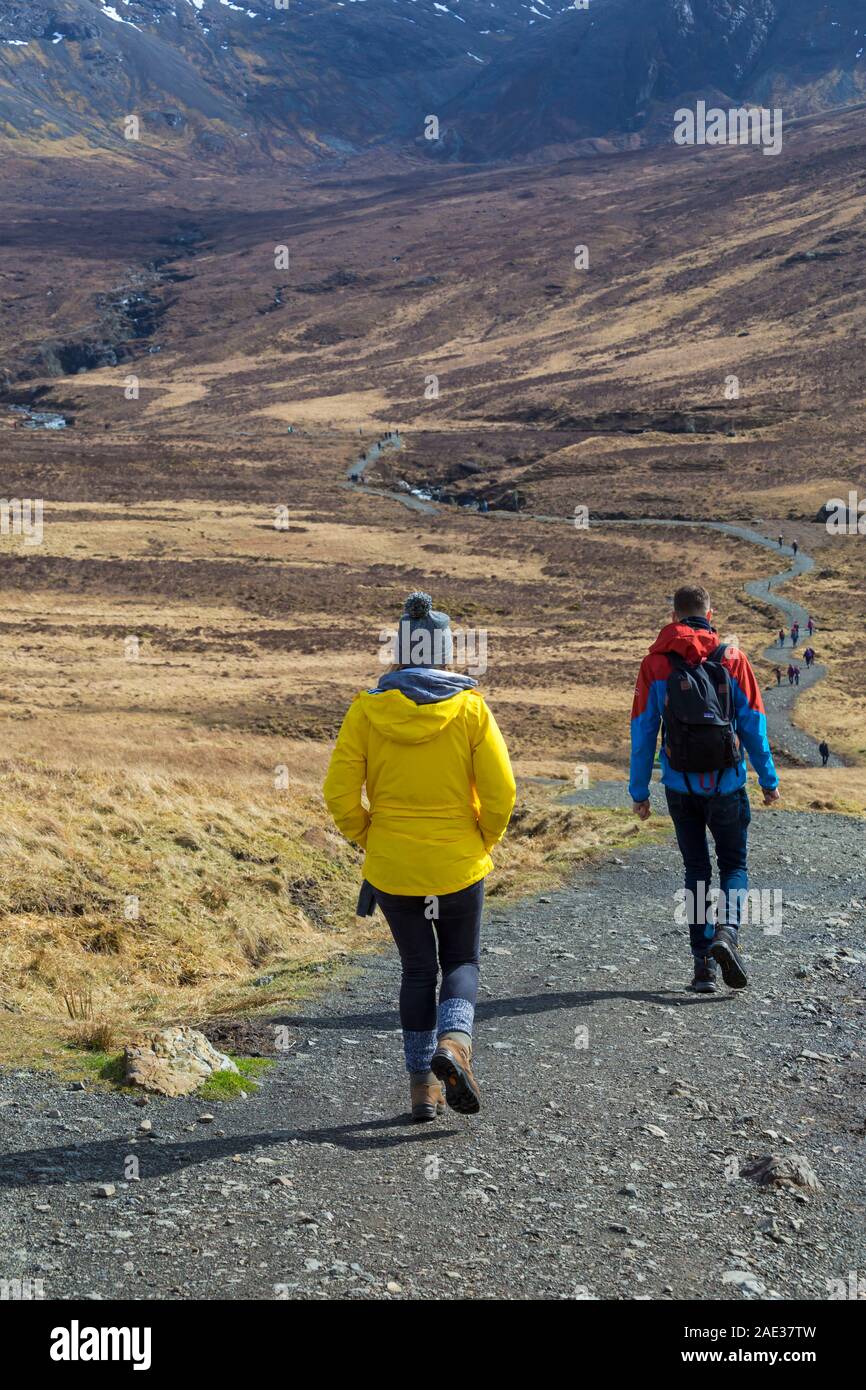 Visitors walking at Fairy Pools, Isle of Skye, Scotland, UK in March Stock Photo