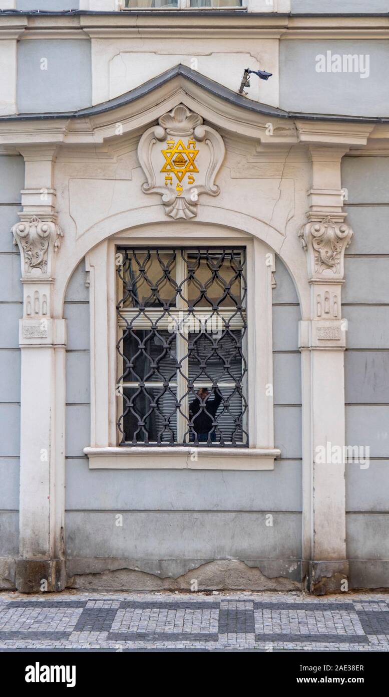 Ornate decorative window cornice with a Star of David on wall of Jewish Town Hall Josefov Jewish Quarter Old Town Prague Czech Republic. Stock Photo
