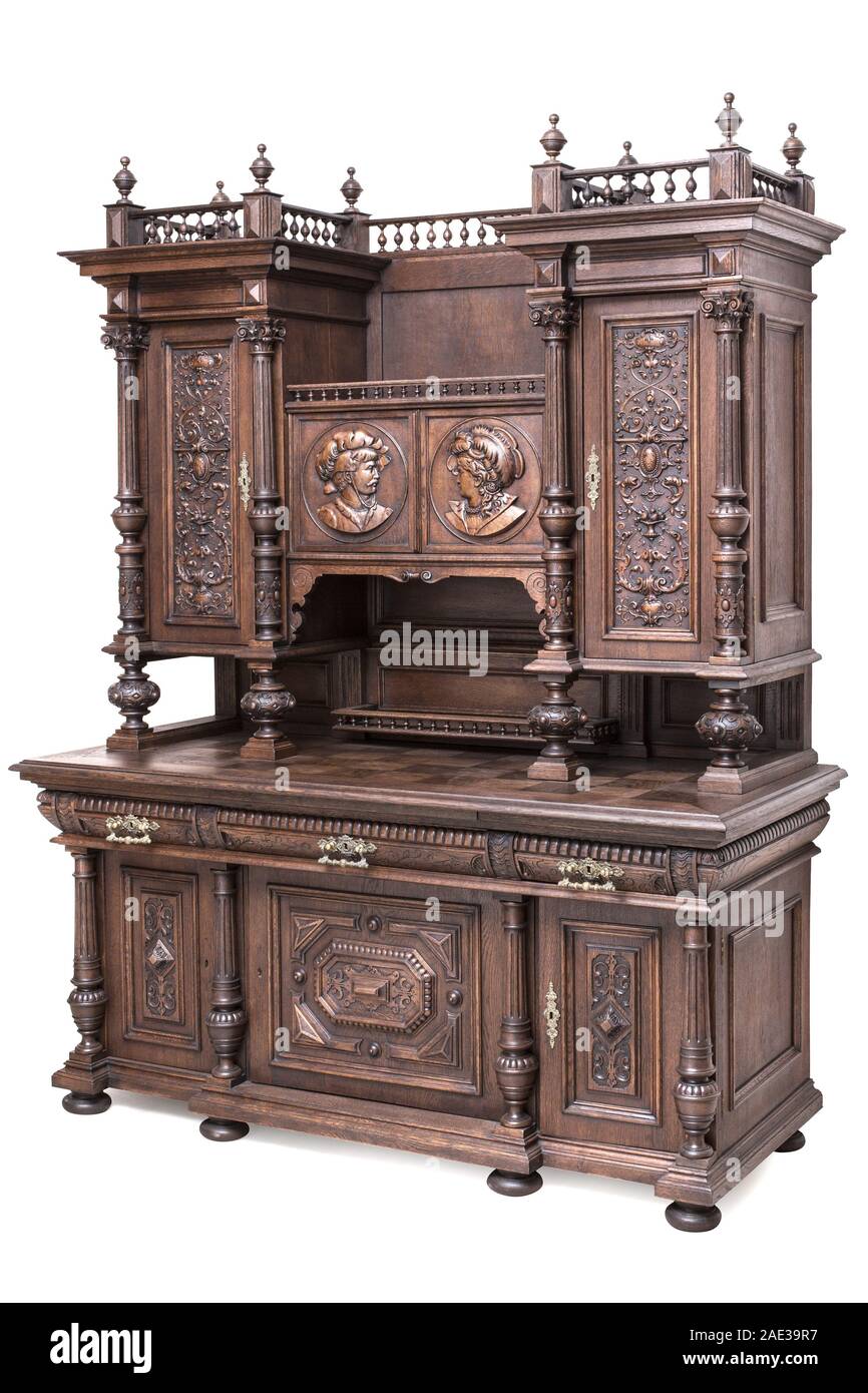 fine specimen of the antique carved sideboard of the late 19th century. Isoleted path on the white background. Stock Photo