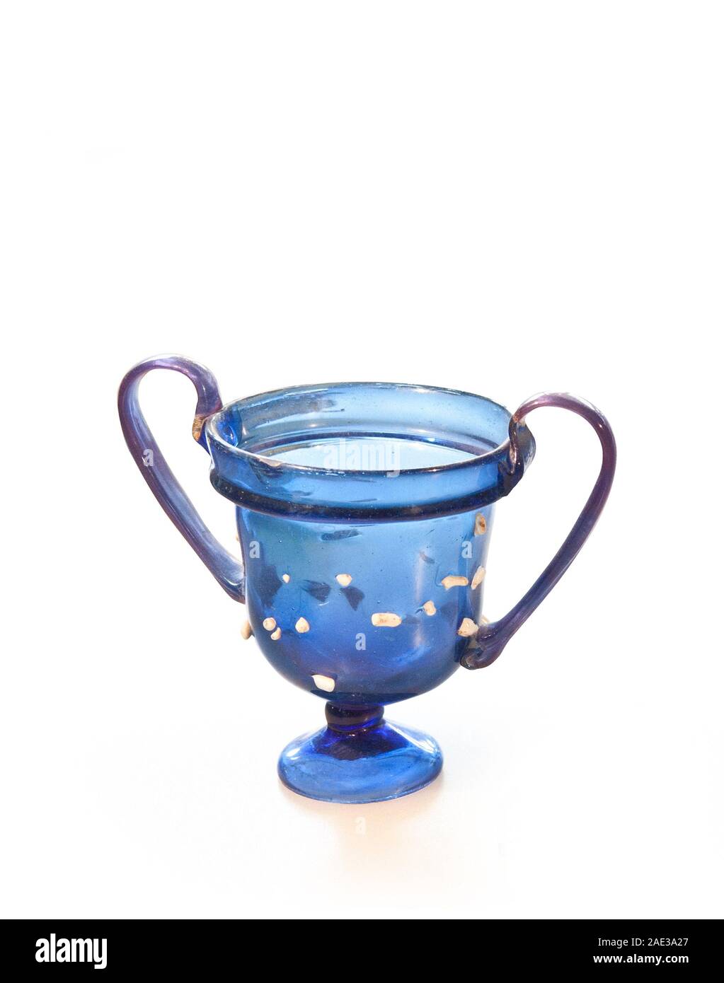 Roman goblet with  two handles from coloroud glass (skyphos). Blue glass mug with two handles. Rome Imperia. 1st - 2nd centuries A.D. There are a lot Stock Photo