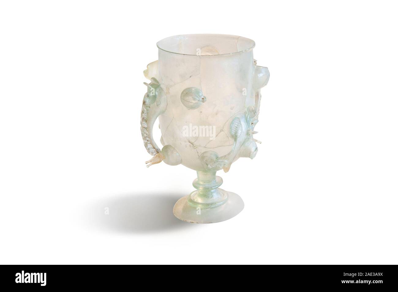 Roman goblet with  two handles from diatretglas glass. Roman Empire. The 3rd and 4th centuries AD. Clipping path for design purpopes. Stock Photo