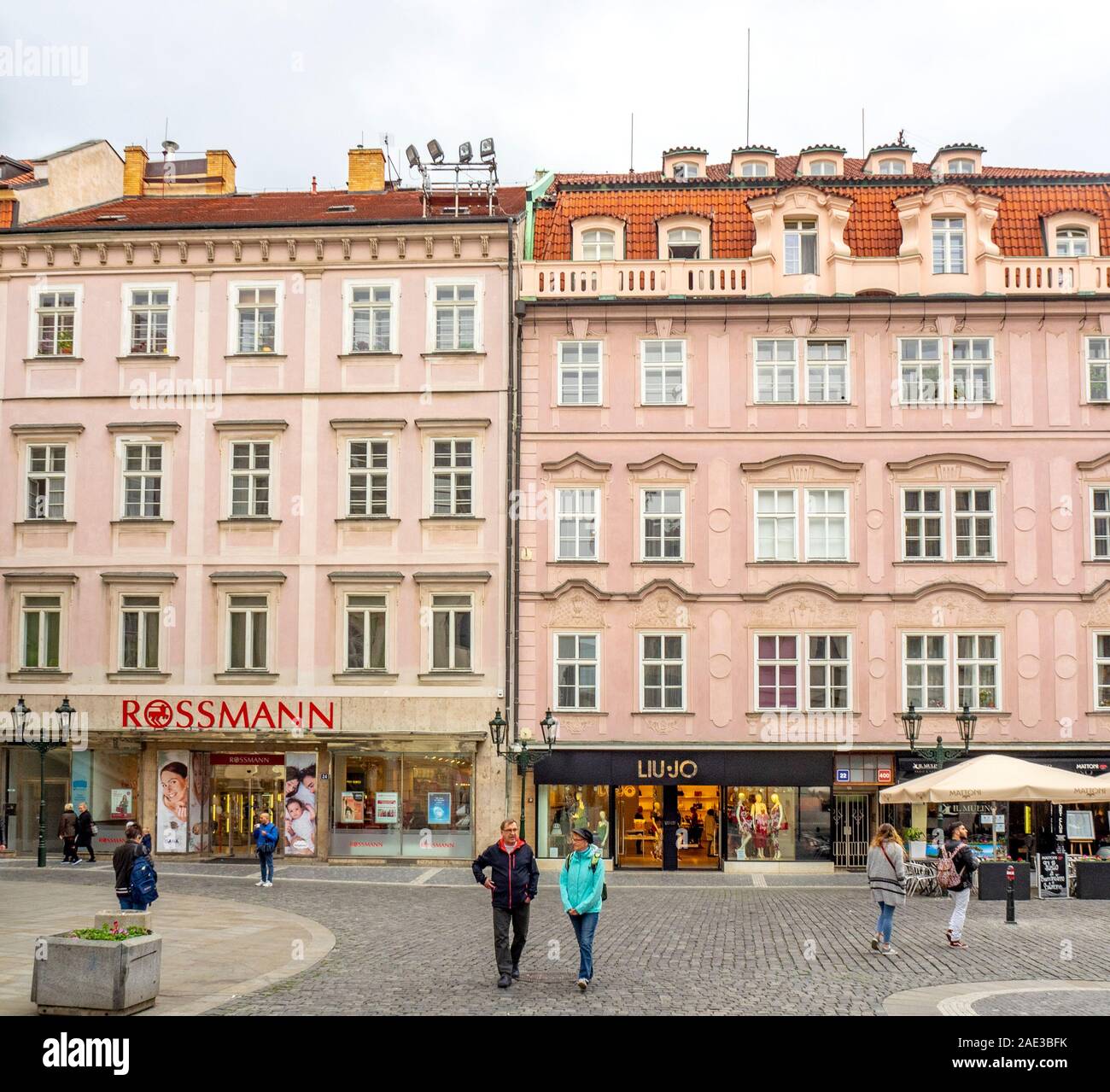 Tourists walking along cobblestone street in shopping precinct in Old Town Prague Czech Republic. Stock Photo
