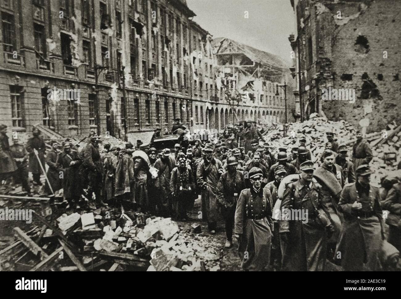A column of captured German soldiers in the destroyed Berlin. 1945 Stock Photo