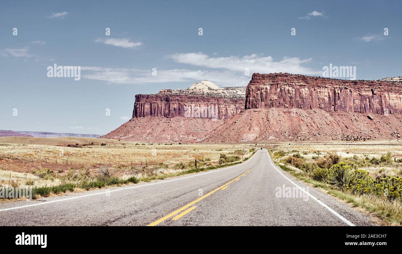 Rock formations by a road in Canyonlands National Park, color toning applied, Utah, USA. Stock Photo