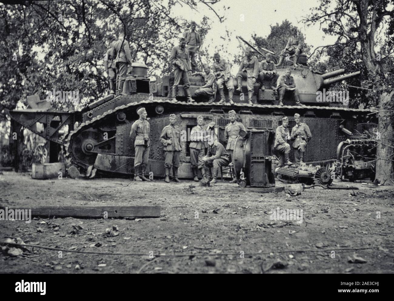 German soldiers posing against the backdrop of the captured French giant tank Char 2C No. 95 Touraine. France, 1940 Char 2C – the largest serial tank Stock Photo