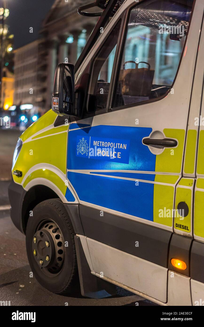 Night Time Close Up Of Passenger Side Door Of Police Van Showing