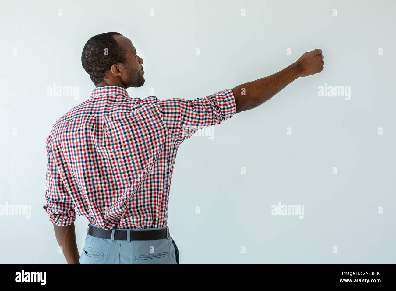 Professional afro american man writing on the board Stock Photo - Alamy