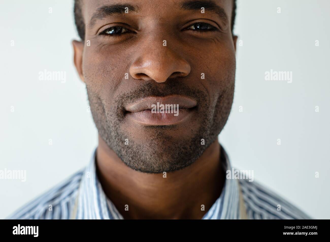 Confident afro americn man standing against white background Stock Photo