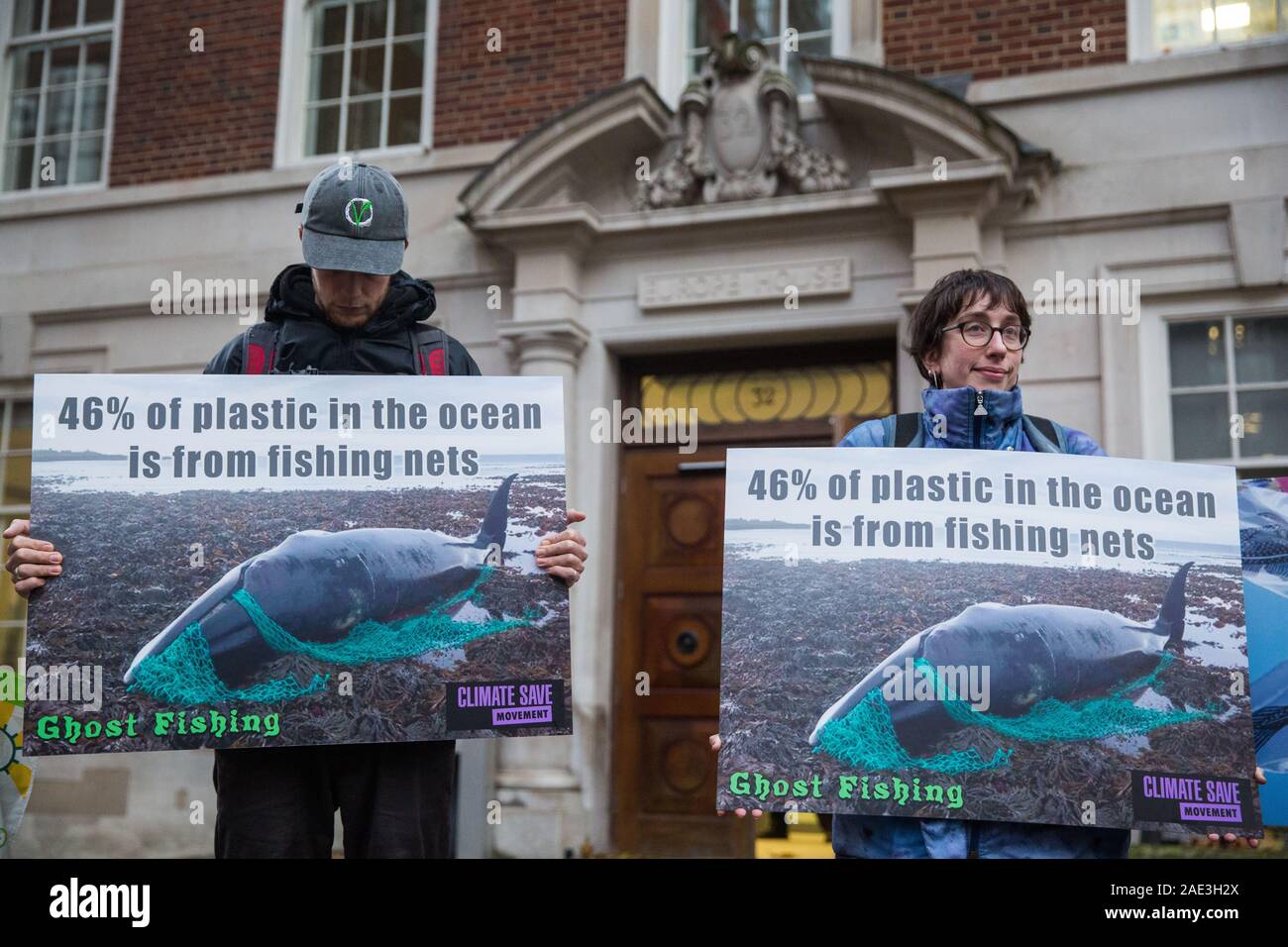 London, UK. 6 December, 2019. Activists from Sea Life Extinction Rebellion, joined by activists from Animal Rebellion, protest against super-trawlers outside the European Commission’s offices in Westminster. Super-trawlers are responsible for much illegal fishing, using nets as large as three football pitches, catching endangered species such as hammerhead sharks and dolphins and processing, storing and freezing thousands of tons of fish during weeks of continuous fishing. Credit: Mark Kerrison/Alamy Live News Stock Photo