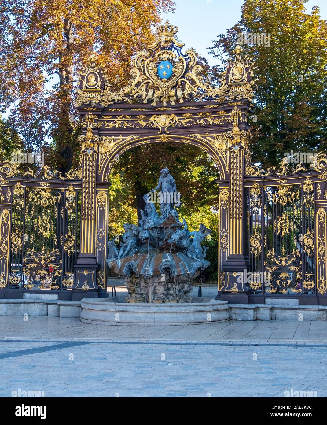 Nancy, France - August 31, 2019: Golden gate to the Place Stanislas square and Fountain in Nancy, Lorraine, France. A UNESCO World Heritage Site Stock Photo