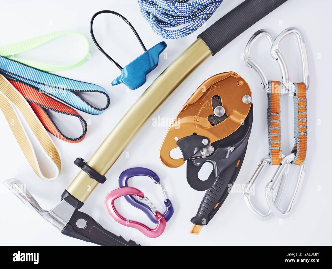 Brand new set. Top view. Climbing equipment for the safeness lying on the white table. Conception of extreme sports Stock Photo