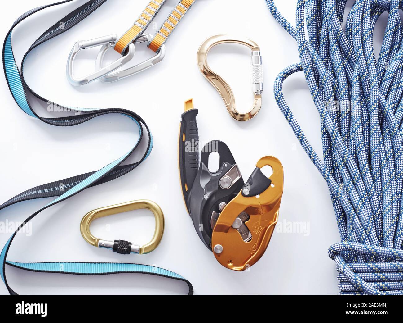 Store shelf. Top view. Climbing equipment for the safeness lying on the white table. Conception of extreme sports Stock Photo