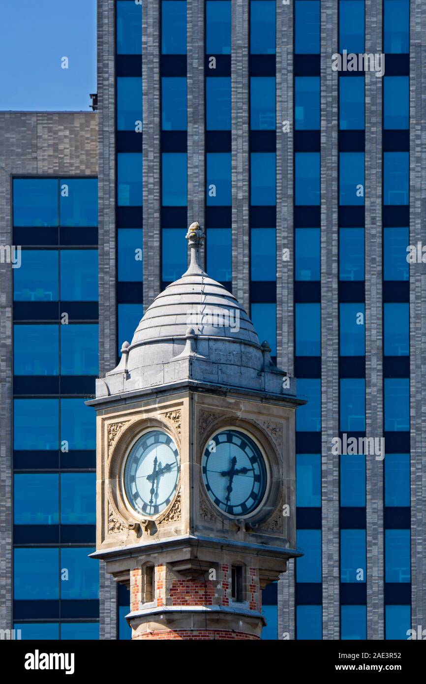 Gent-Sint-Pieters railway station clock tower and Virginie Loveling building / VAC, governmental office in the city Ghent, East Flanders, Belgium Stock Photo