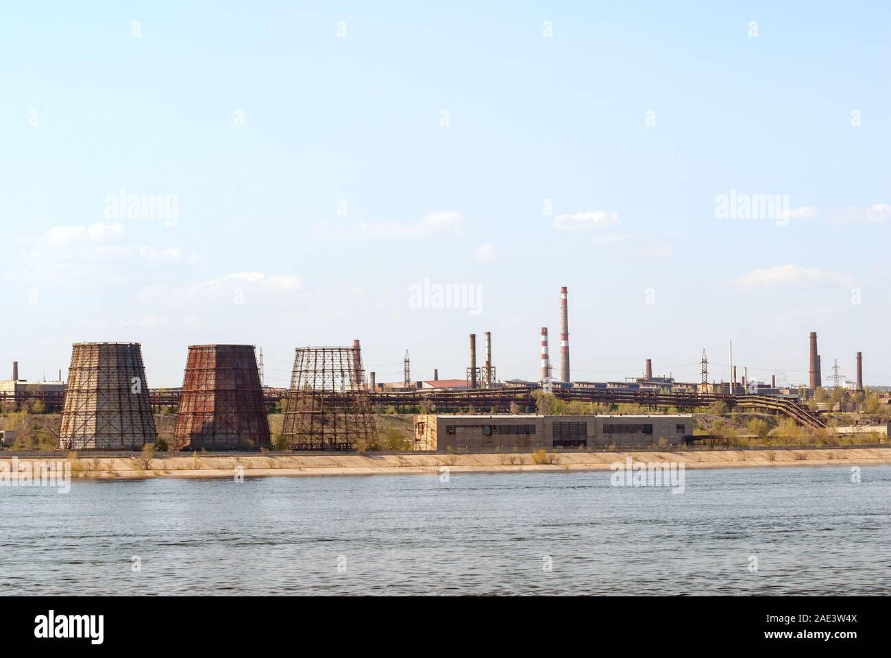 Ironworks located on the river coastline. Industrial landscape. Stock Photo