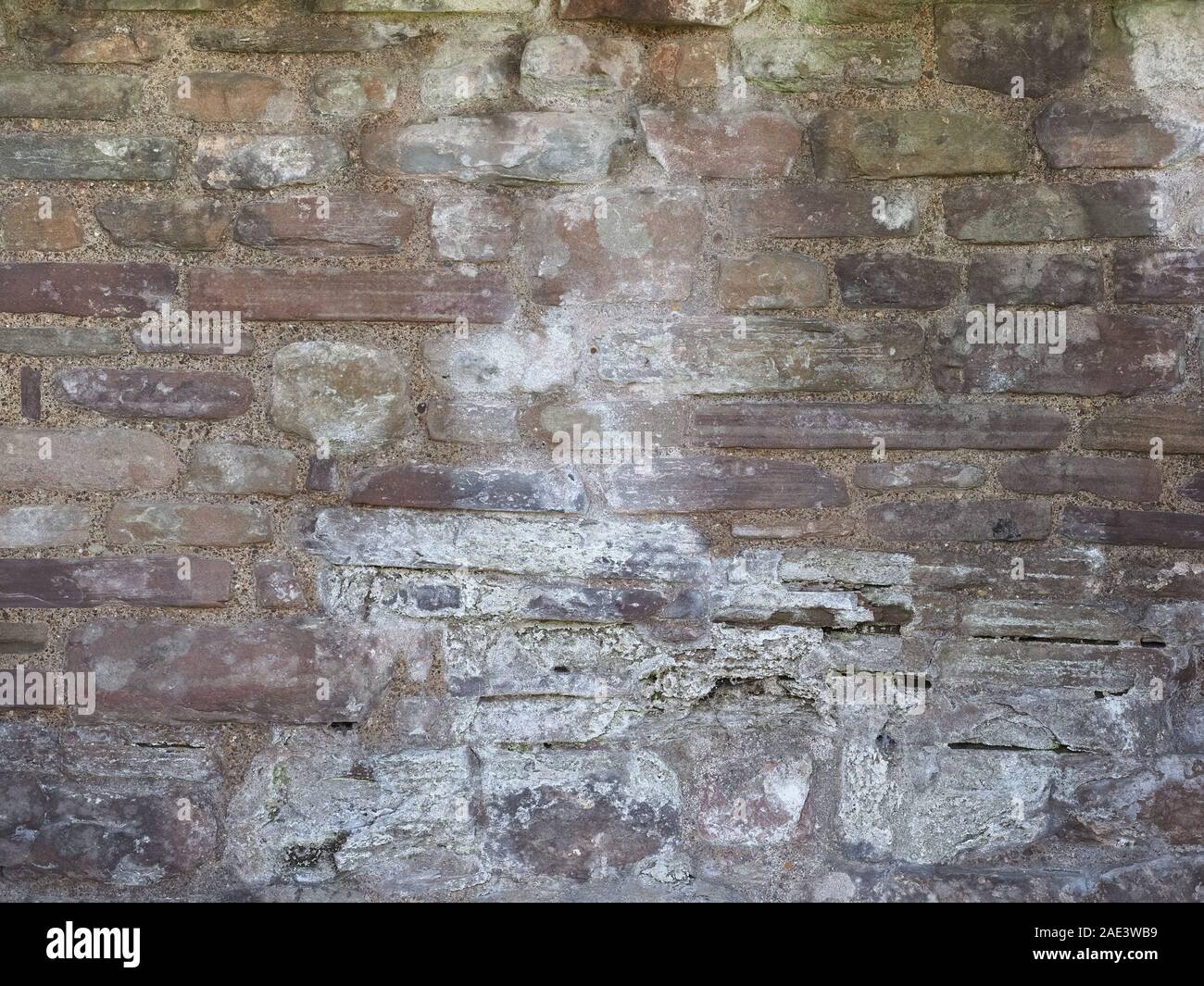grey stone wall useful as a background Stock Photo - Alamy