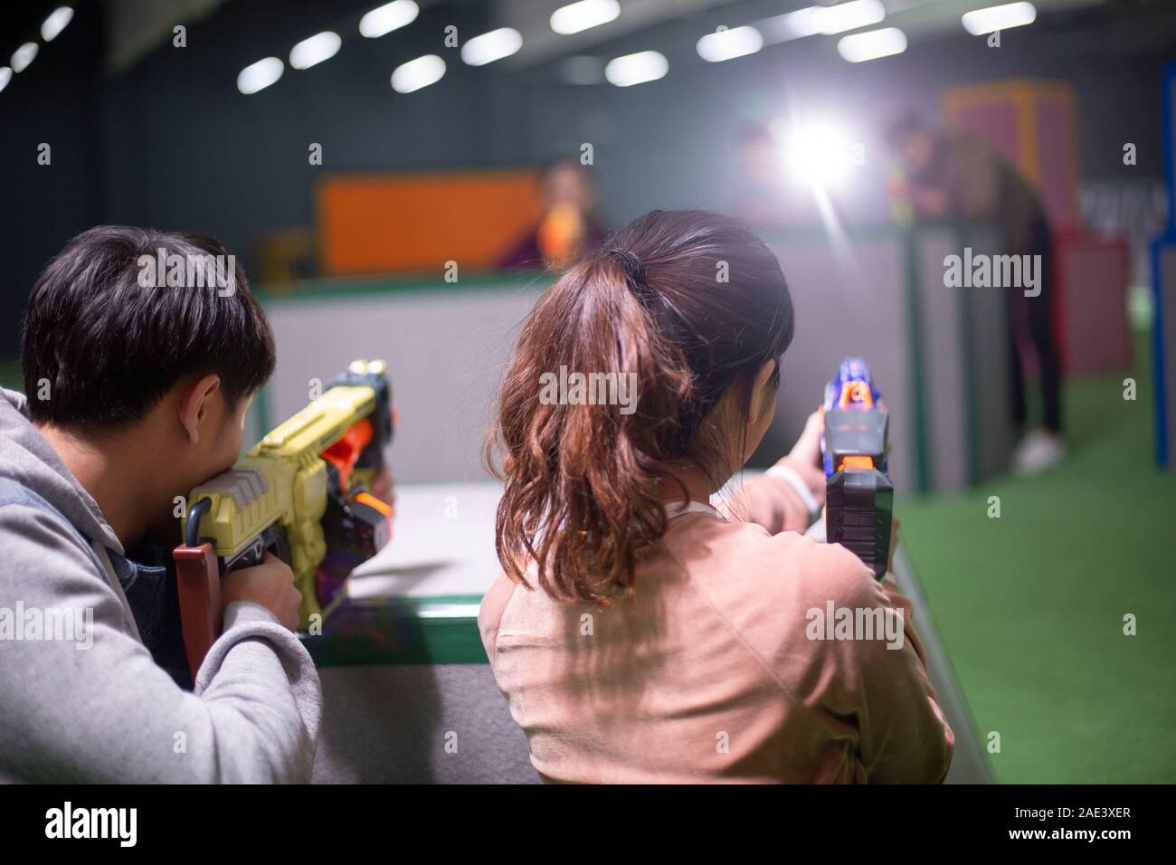 Young friends playing gun game Stock Photo Alamy
