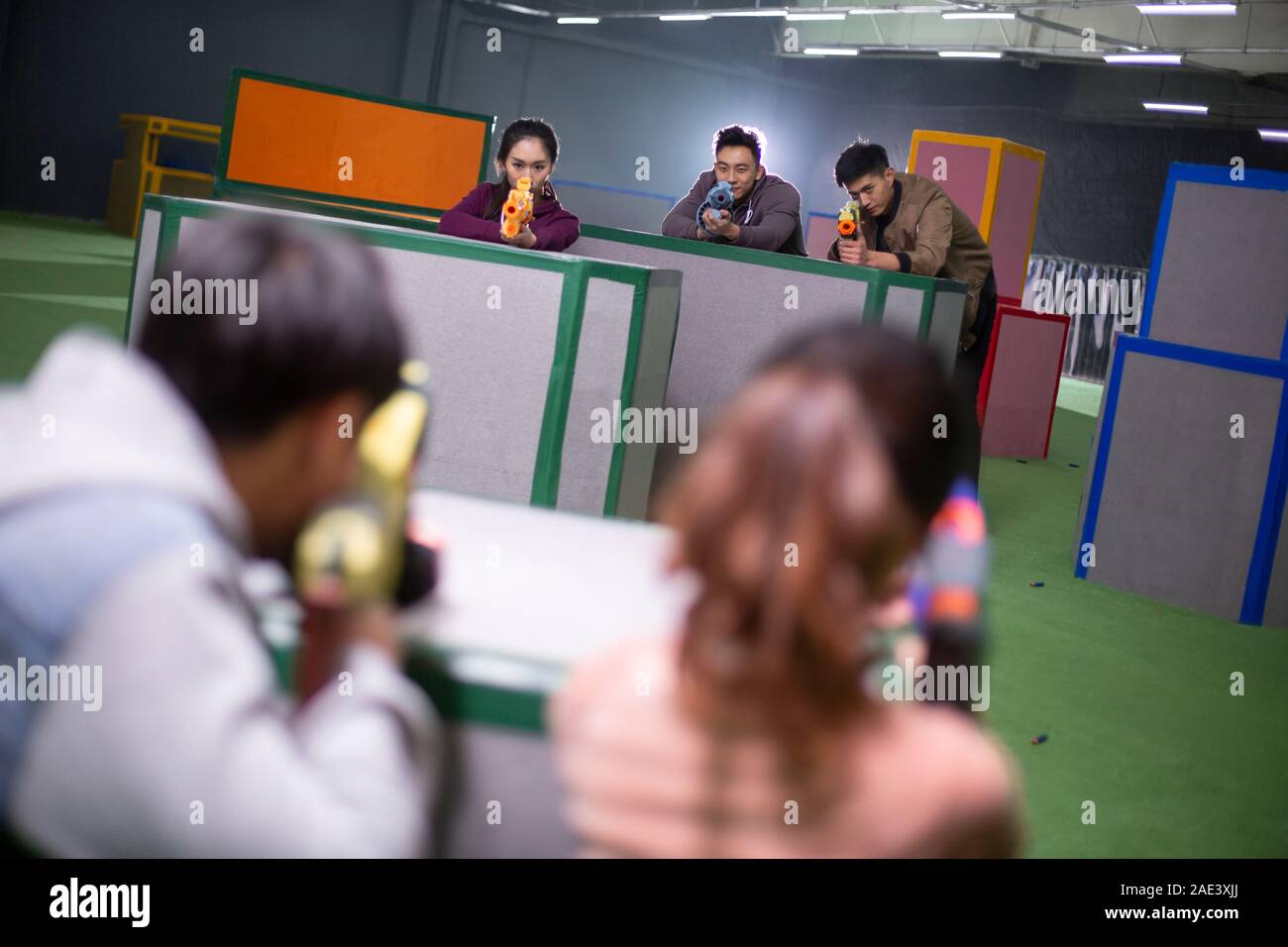 Young friends playing gun game Stock Photo Alamy