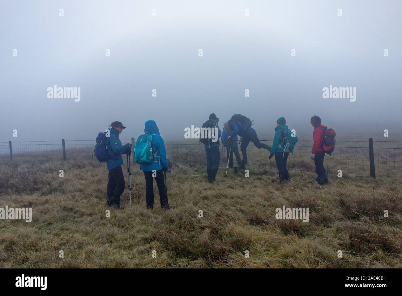 Hillwalkers ascend the path to Ben Cleuch, Alva, Stirlingshire, Scotland Stock Photo