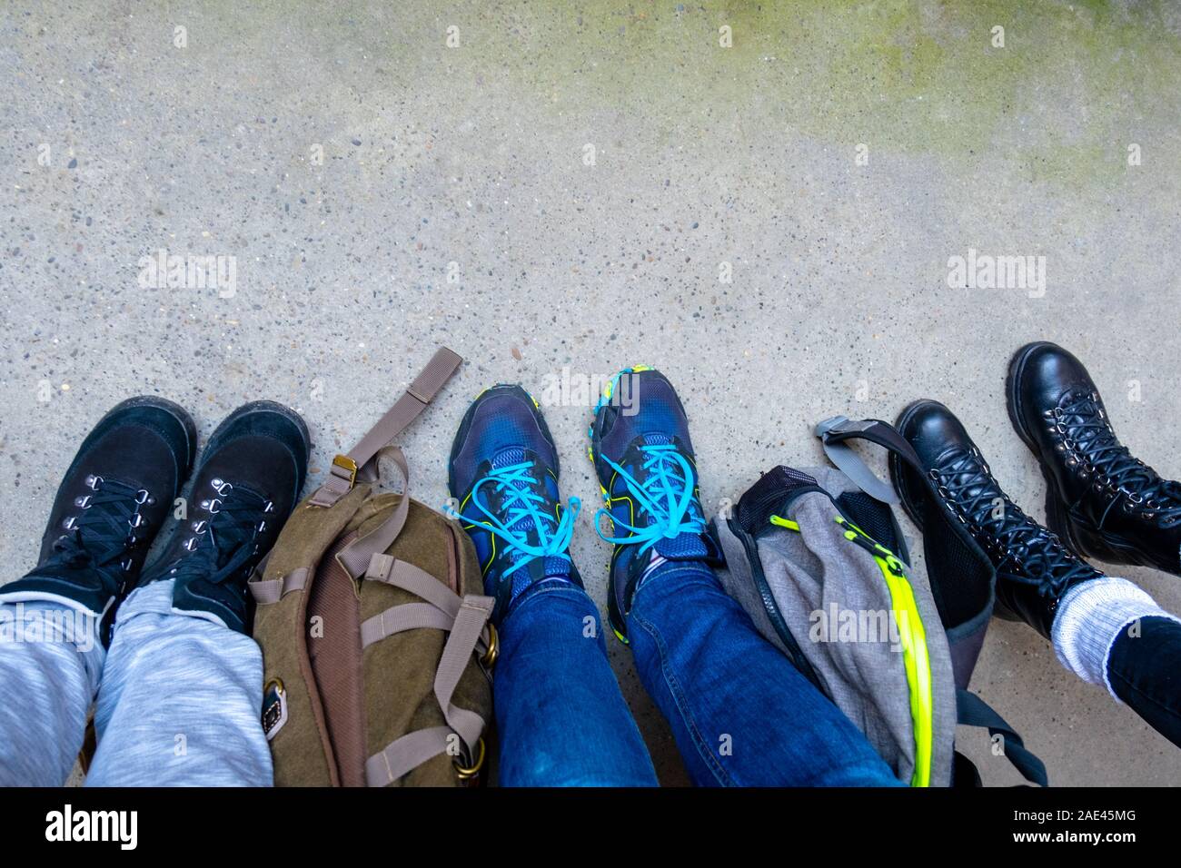 hiking stand on the grey pavement 