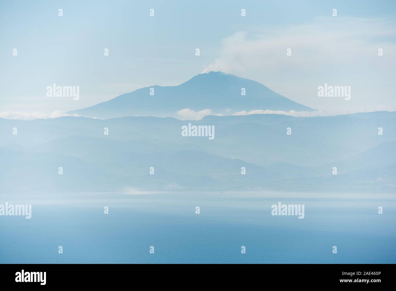 the etna active volcano blue silhouette trough atmospheric perspective Stock Photo